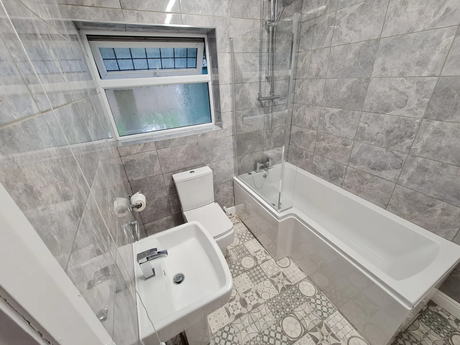 Finished tiled bathroom renovation with modern fixtures