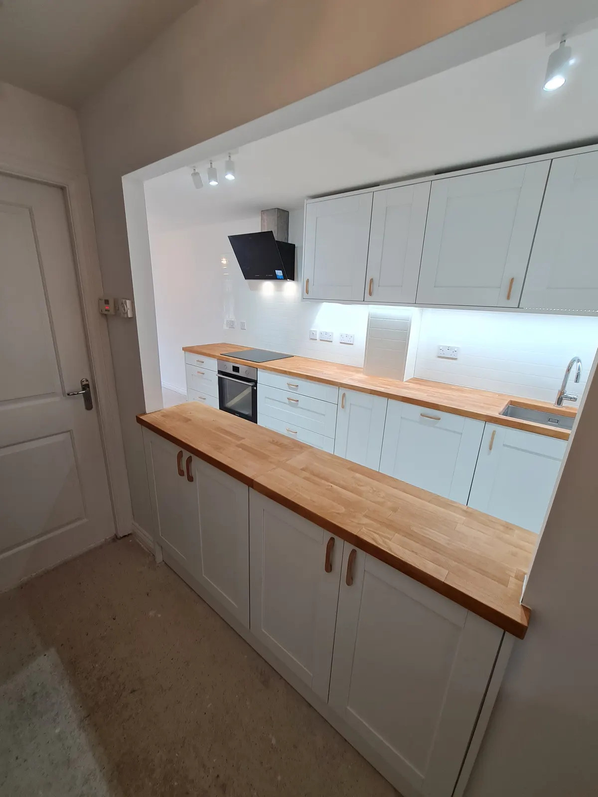 Completed kitchen featuring a central island and coordinated finishes